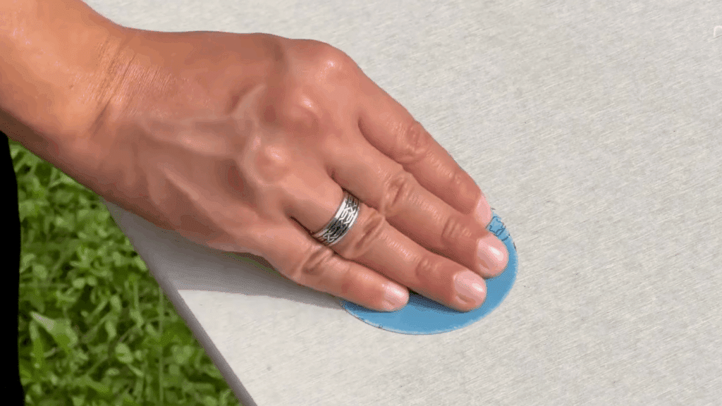 scrub surface debris