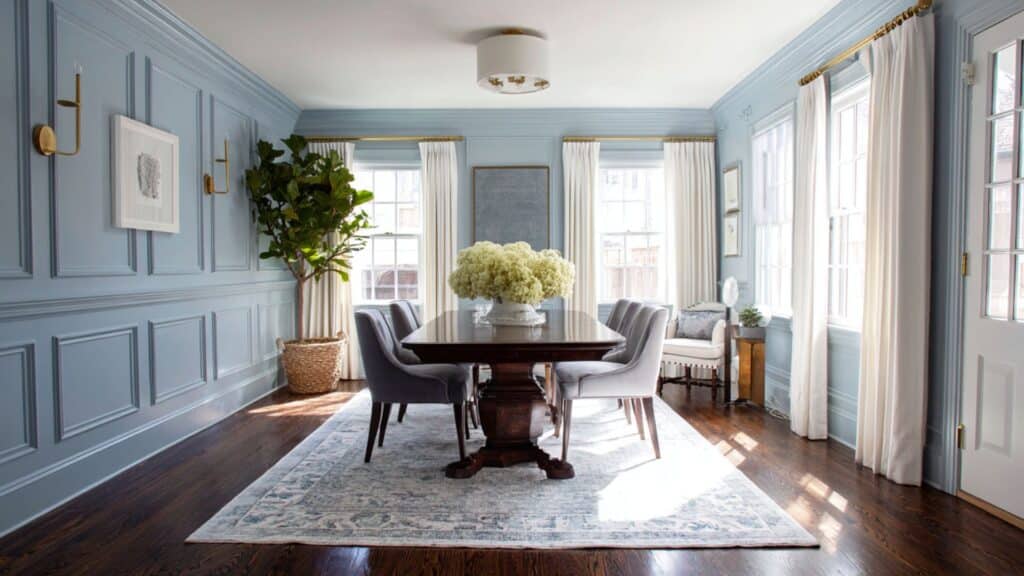soft powder blue dining room with dark floors