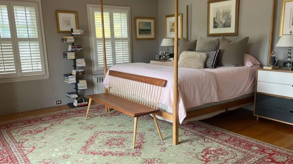 only the foot of the bed on the rug