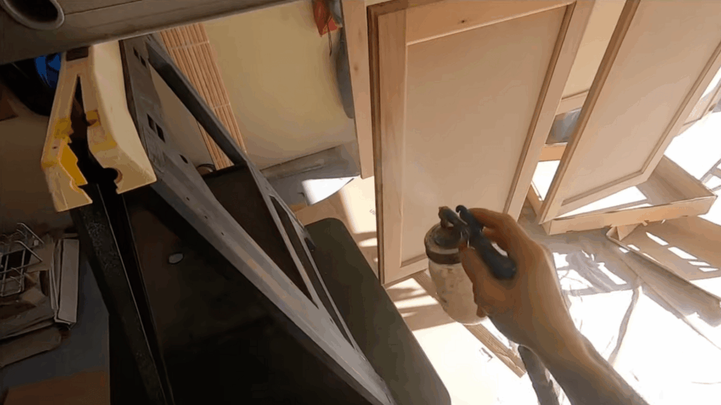 spray the sanding sealer on bare wood